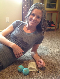 Using Yoga Tune Up balls to release tension between the shoulder blades
