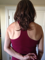 Hand behind the back with shoulder blades wide